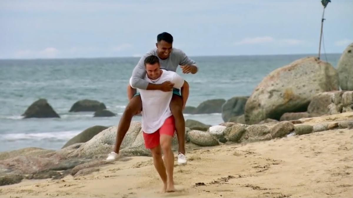 James Bonsall gives Aaron Clancy a piggy back ride on the beach