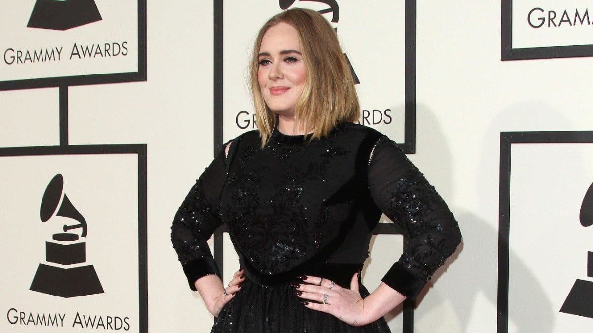 Adele posing for photos at the 58th annual Grammy awards