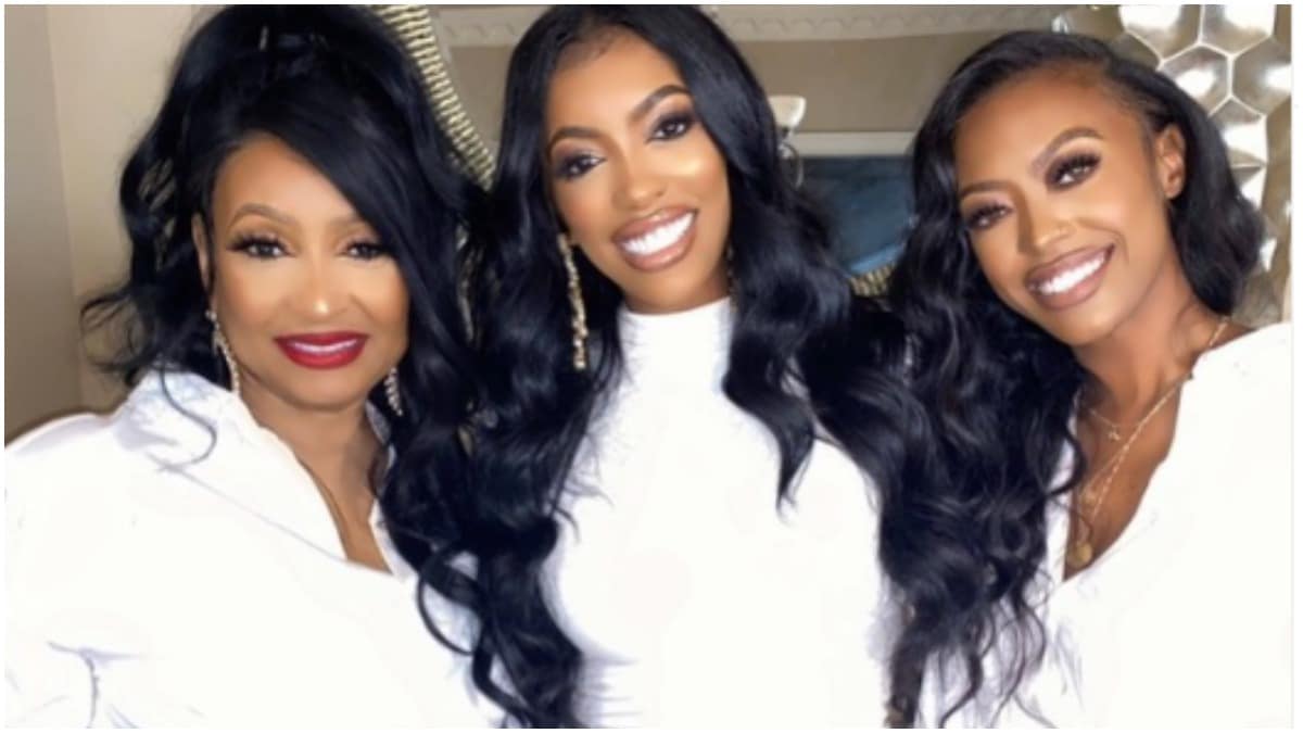 Diane Williams smiling with Porsha Williams and her sister, Lauren Williams