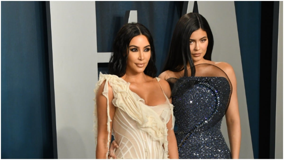 Kim Kardashian and Kylie Jenner posing at the 2020 Vanity Fair Party.