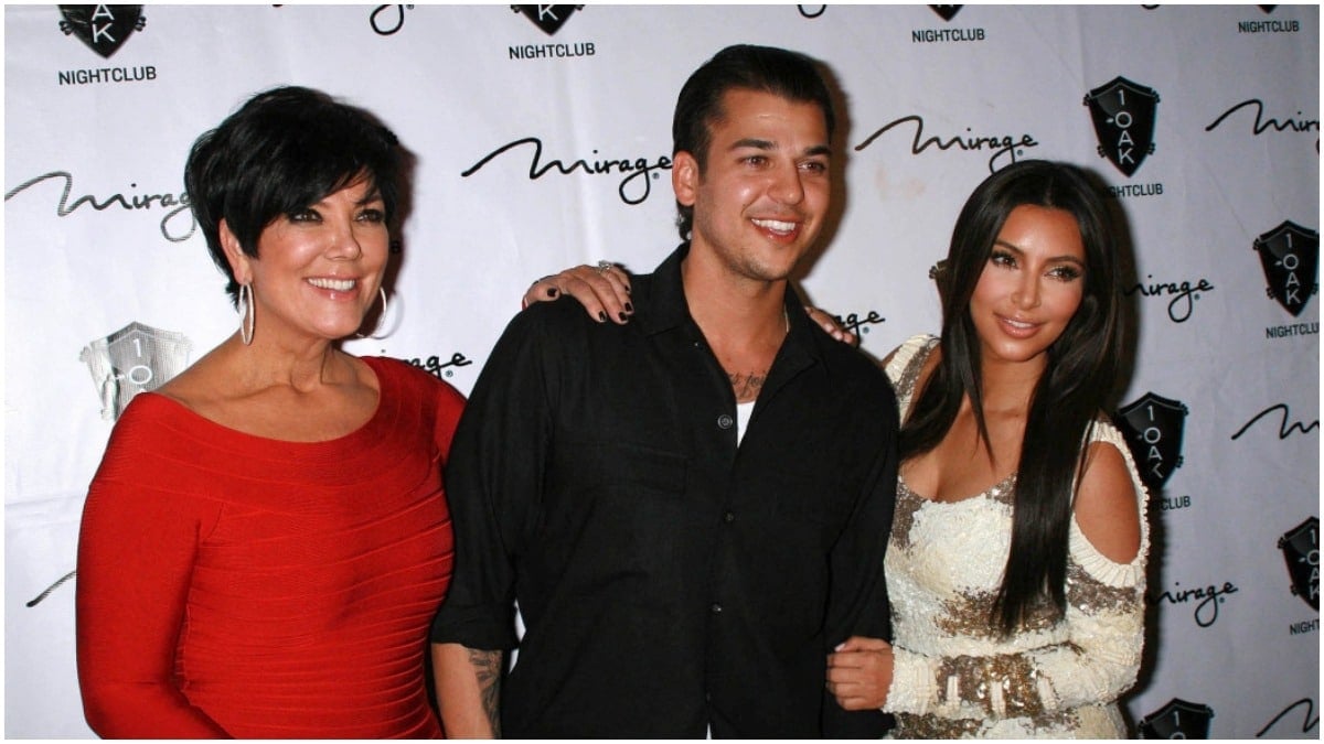 Kris Jenner, Rob Kardashian, and Kim Kardashian smiling at an event.