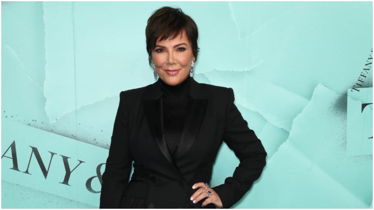 Kris Jenner posing in an all-black outfit at a Tiffany's event.
