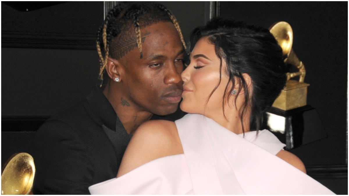 Travis Scott and Kylie Jenner sharing a kiss on the Grammys red carpet.