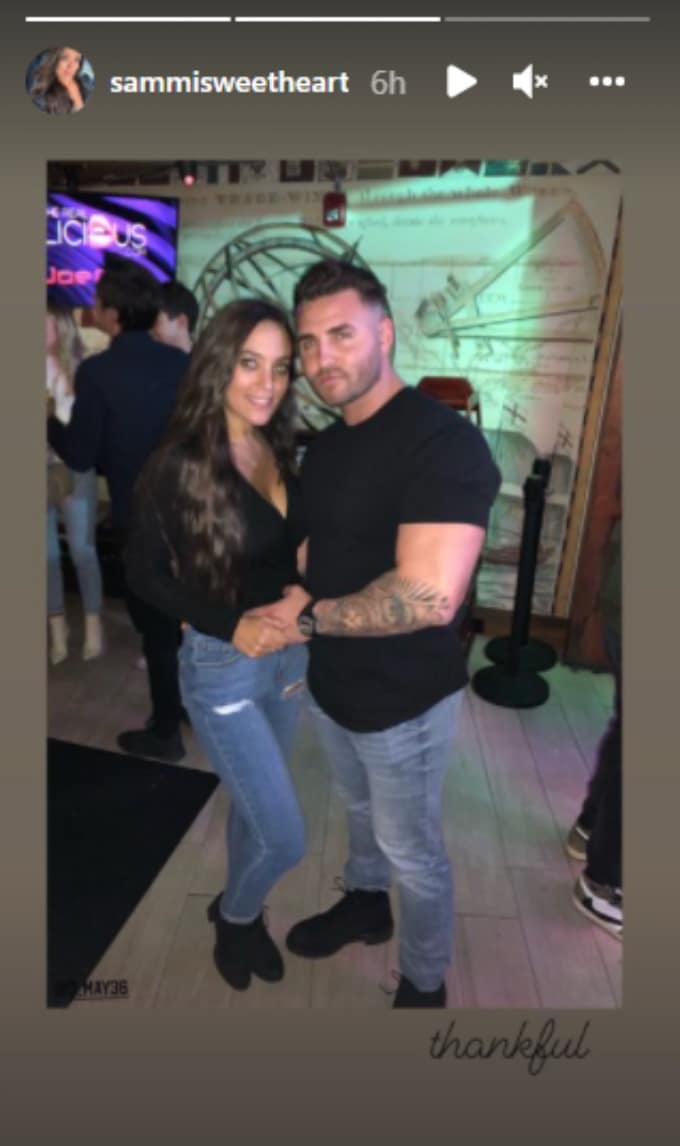 Sammi poses with a new man.