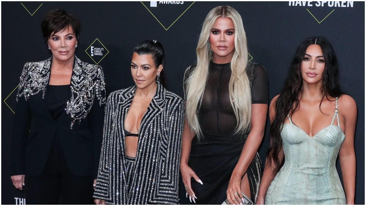 Kris Jenner, Kourtney Kardashian, Khloe Kardashian, and Kim Kardashian posing on the red carpet.