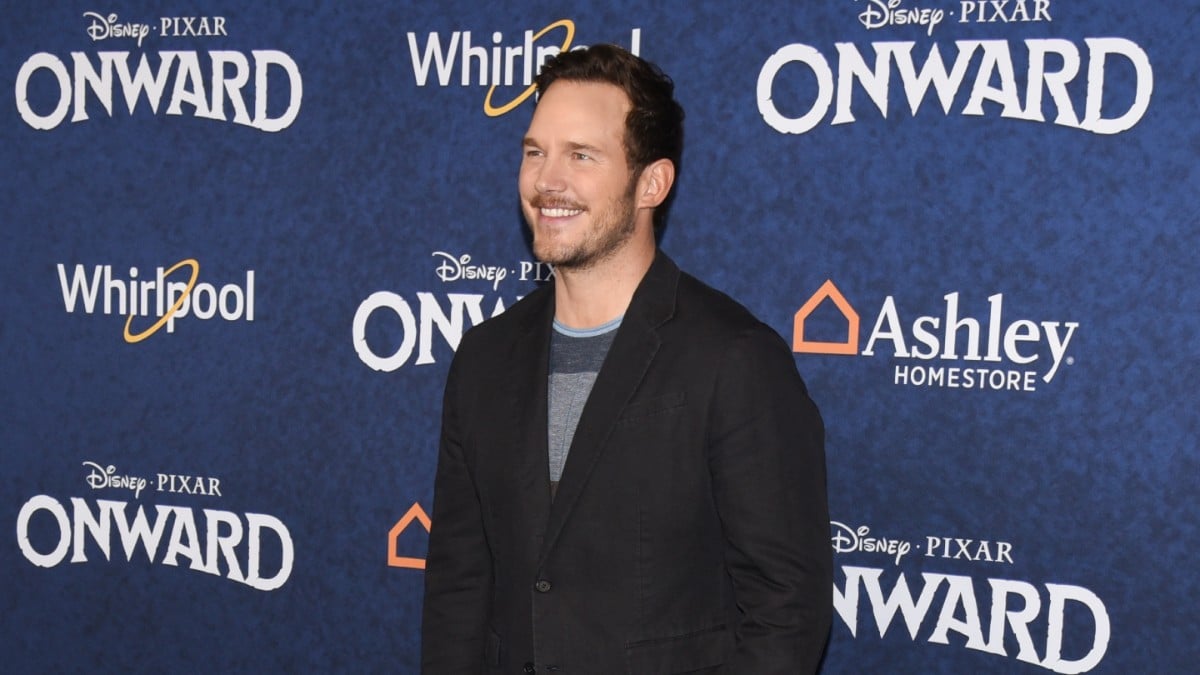 Chris Pratt poses for photos at the premiere of Pixar's Onward