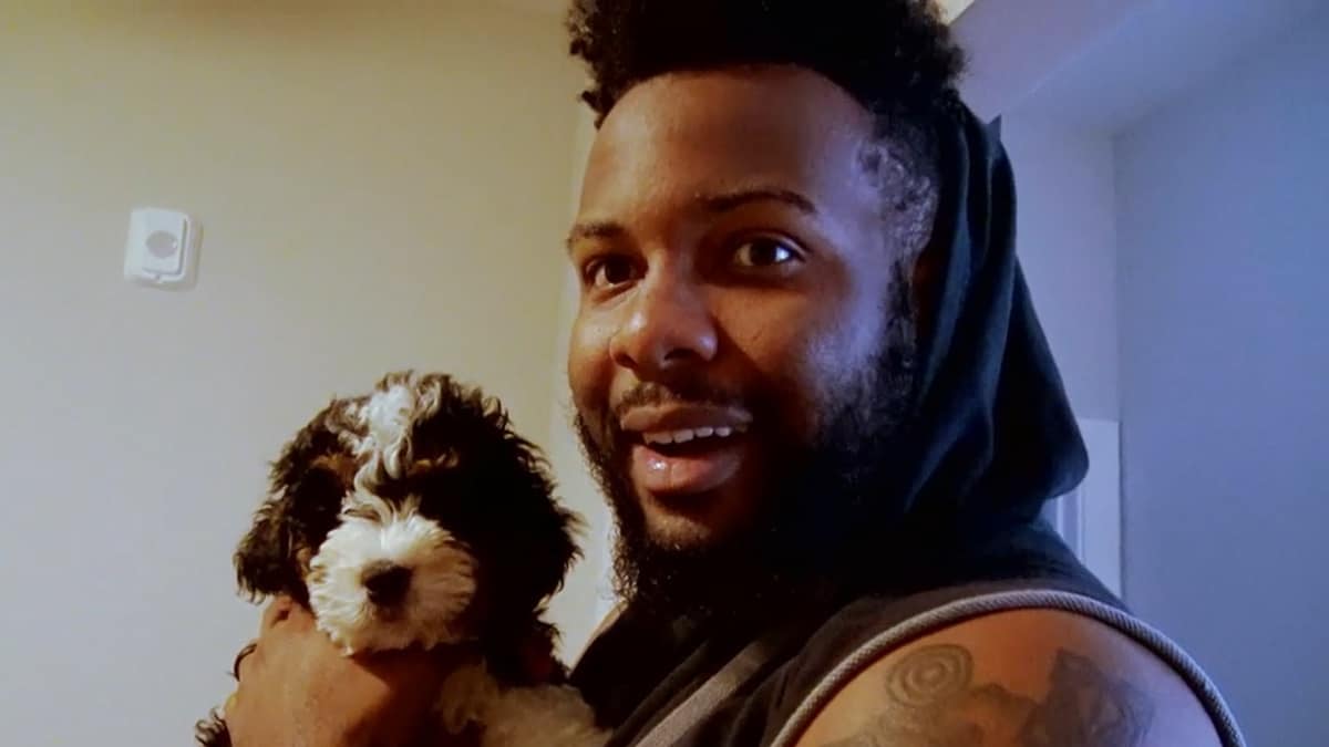 MAFS Miles smiles with his new puppy.