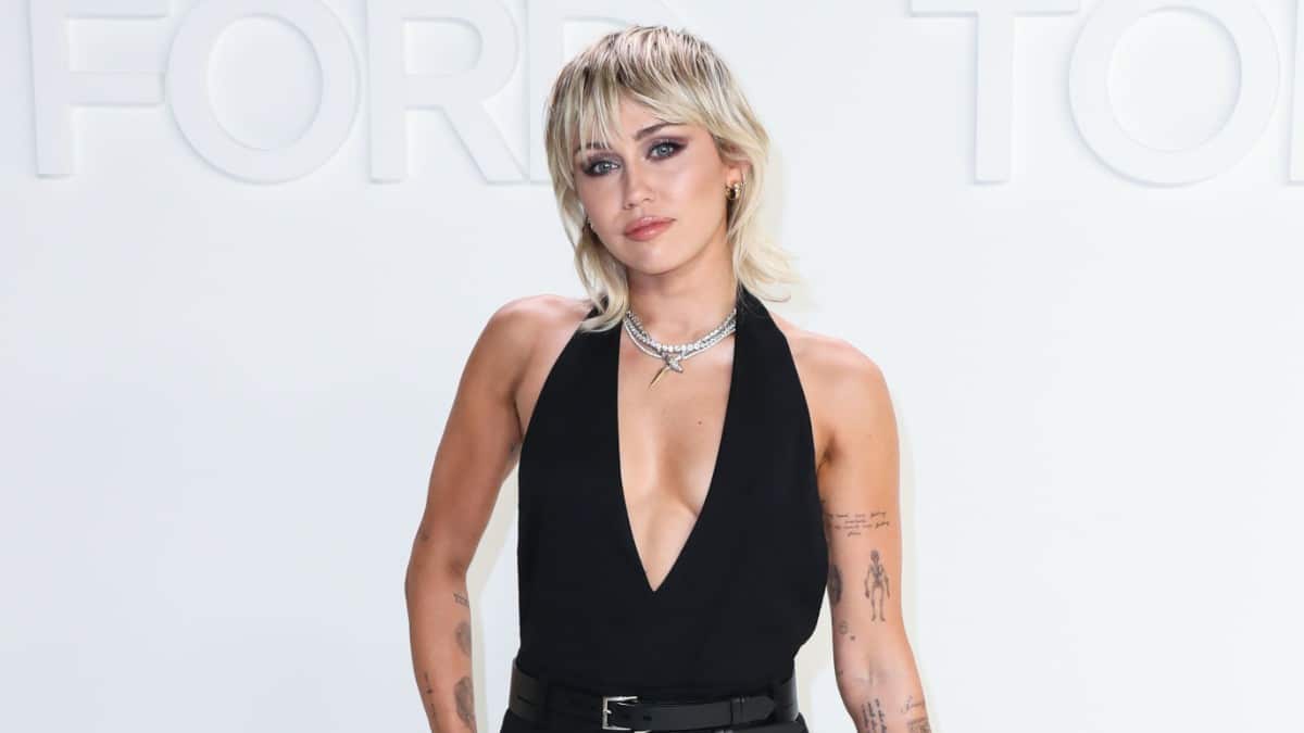 Miley Cyrus posing for photos upon arriving at Tom Ford Autumn/Winter 2020 Fashion Show