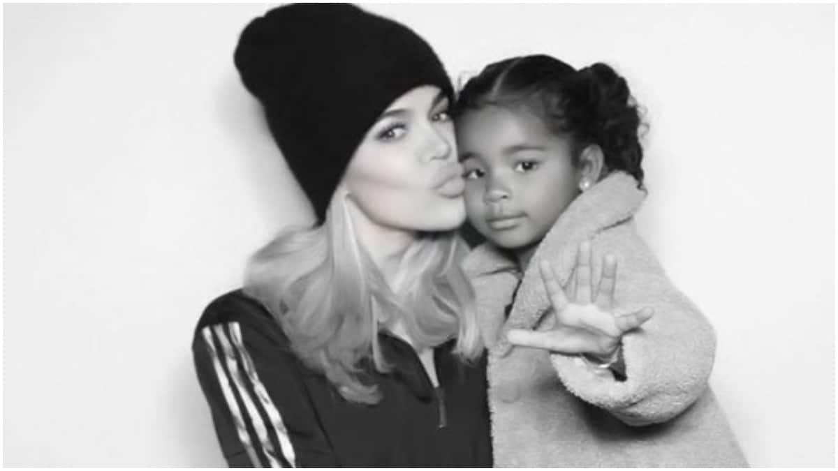 A black and white photo of Khloe Kardashian and True Thompson.