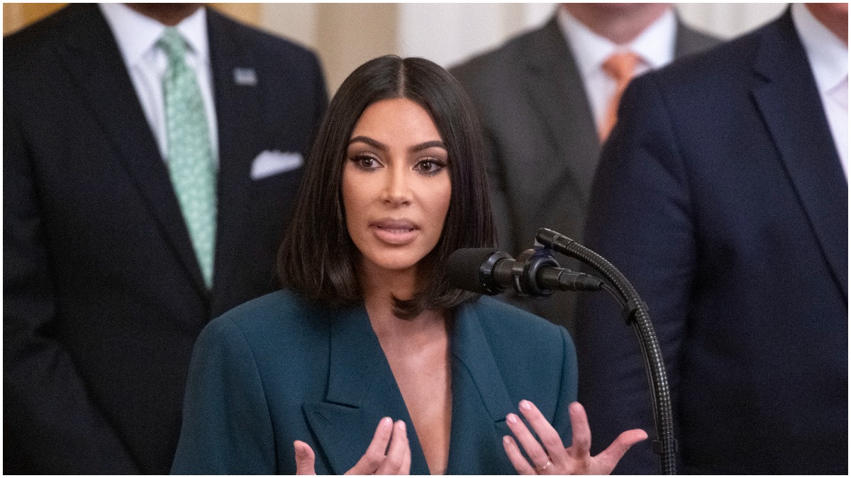 Kim Kardashian talking and looking at an audience while attending the United States President Donald J. Trump's second chance hiring event in the East Room of the White House in Washington, DC