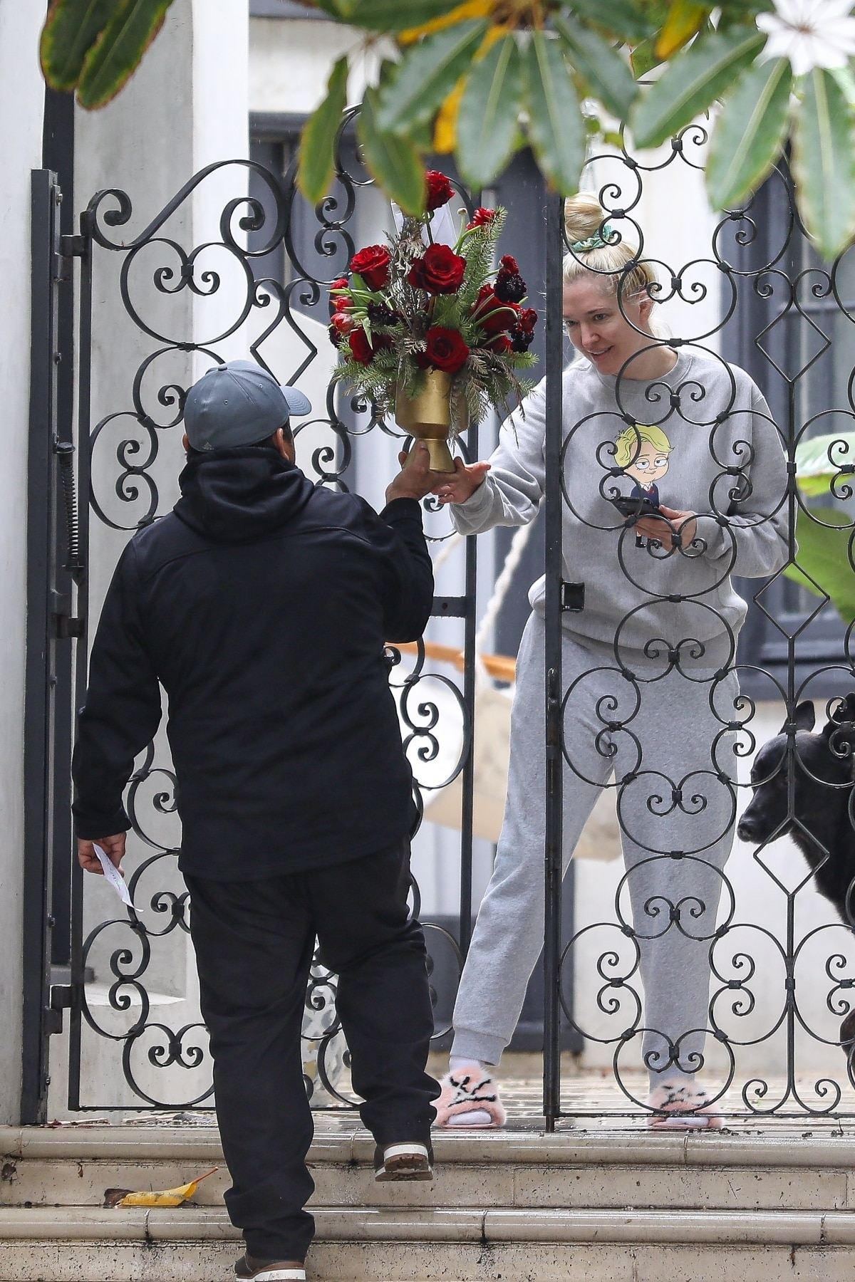 RHOBH star Erika Jayne receives flowers at her Los Angeles home after a positive COVID-19 diagnosis