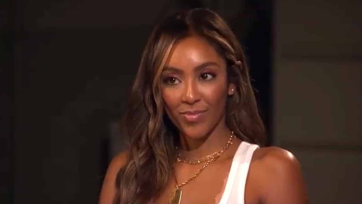 Tayshia Adams in a white tank