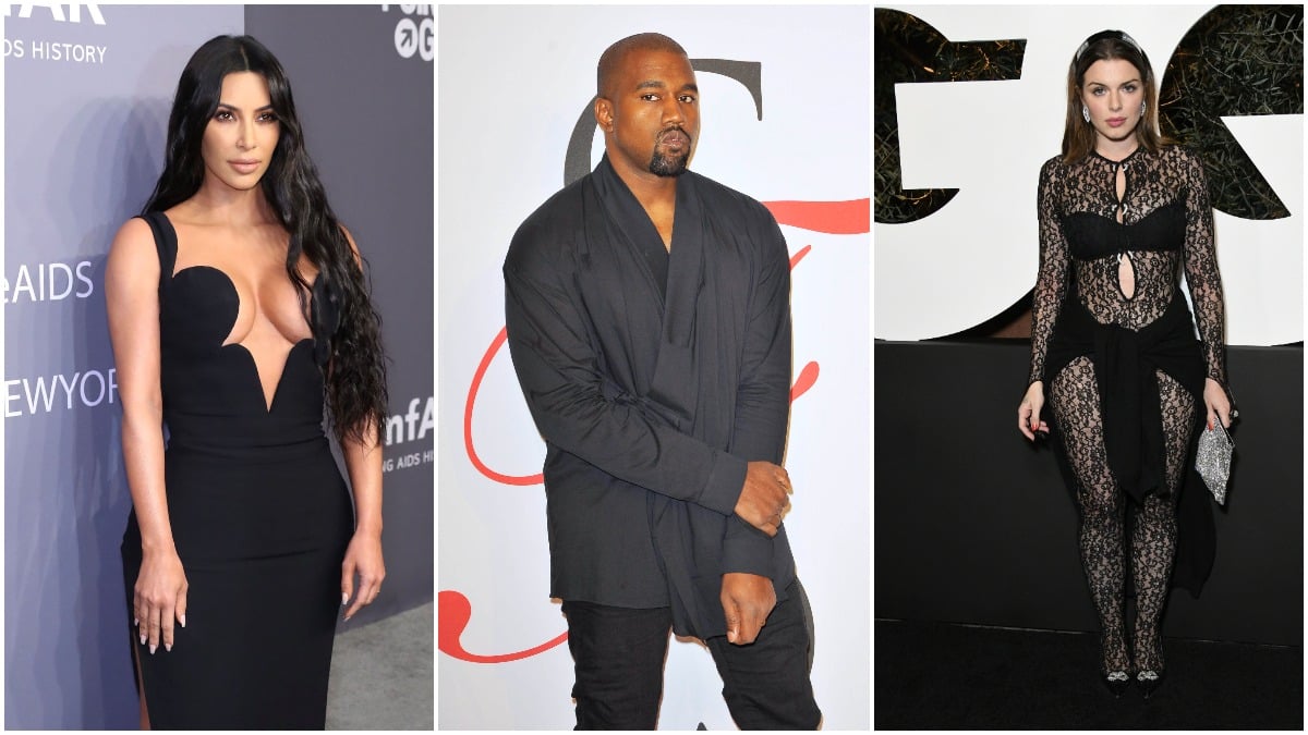 Kim Kardashian, Kanye West, and Julia Fox posing on the red carpet in black outfits.