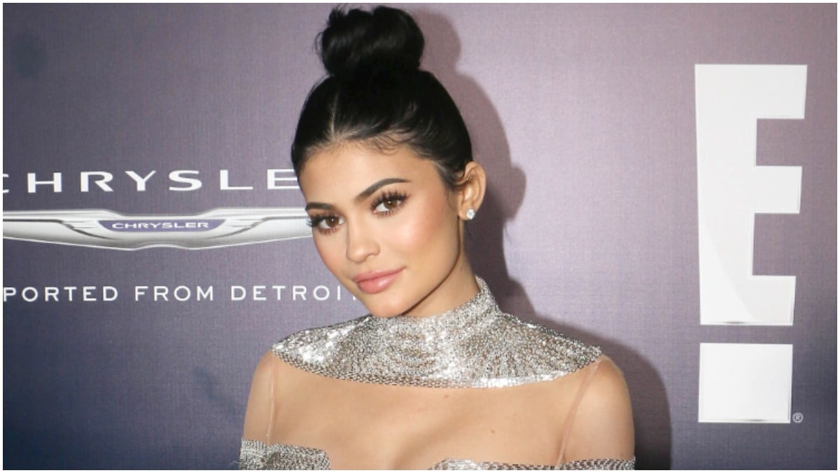 Kylie Jenner smiling for the camera at an event for E!