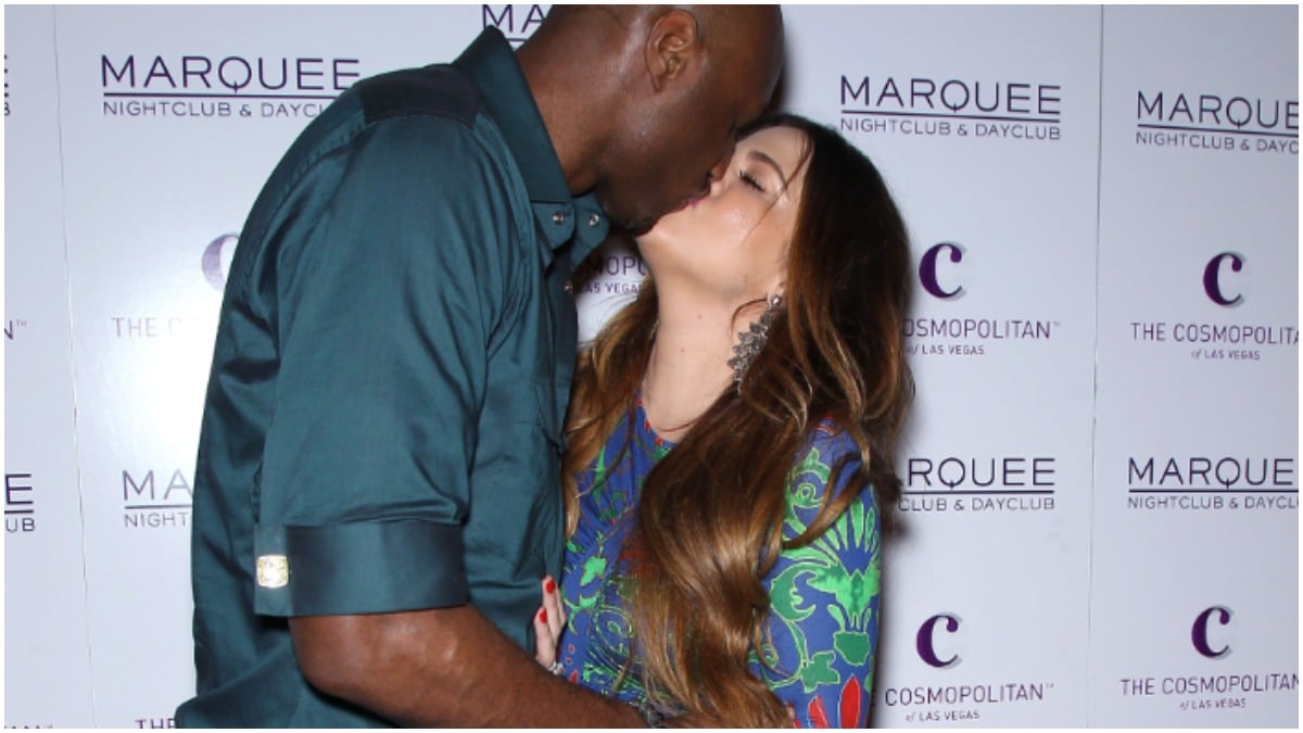 Lamar Odom kissing Khloe Kardashian at Kim Kardashian's party.