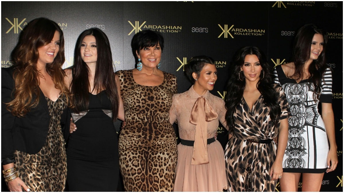 The Kardashian-Jenners posing on the red carpet at an event.