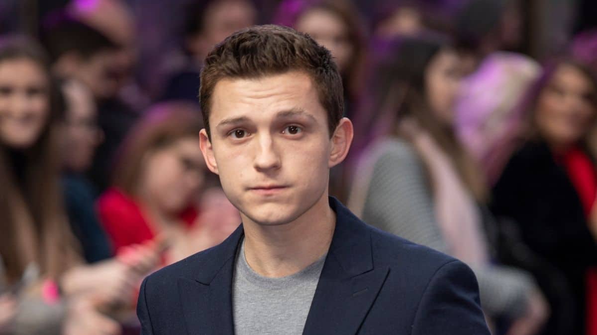 red carpet image of tom holland in a suit