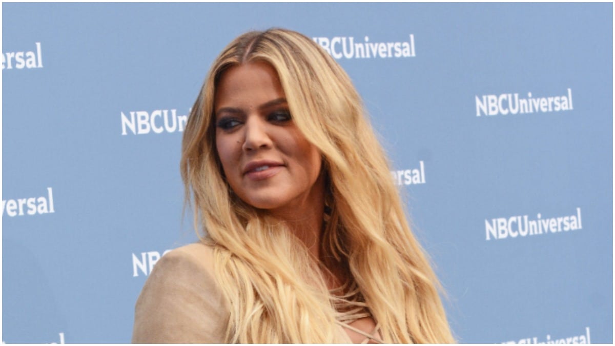 Khloe Kardashian looking away from the camera at an event.