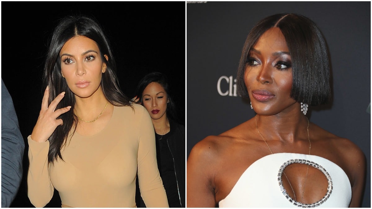 Kim Kardashian walking and touching her hair and Naomi Campbell looking away from the camera.