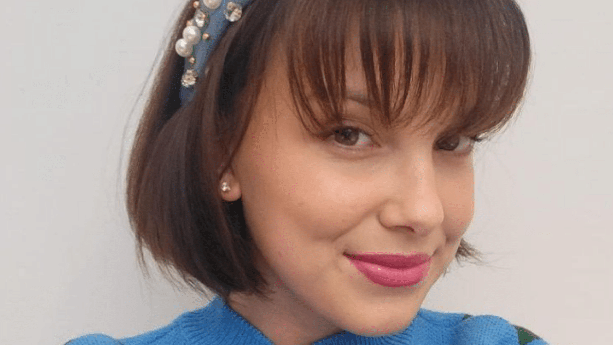 Millie Bobby Brown poses for a selfie to promote her makeup brand.