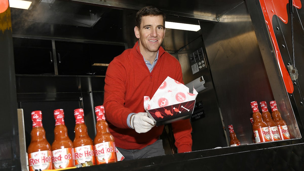 former giants quarterback eli manning gives out frank's redhot wings in nyc