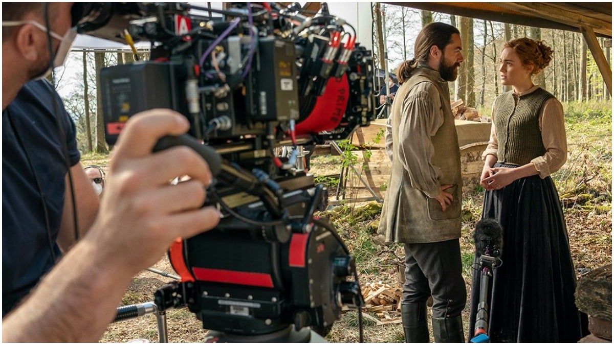 Behind-the-scenes shot of Richard Ranking as Roger and Sophie Skelton as Brianna in Season 6 of Starz's Outlander