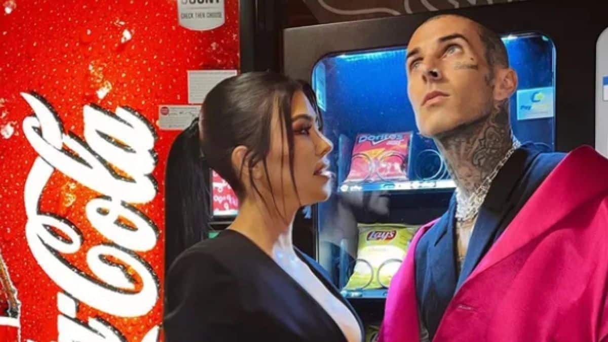 Kourtney Kardashian and Travis Barker stand together in front of a coke machine