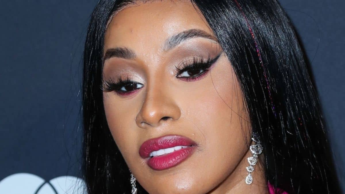 Cardi B serves balls in busty bra and brief skirt