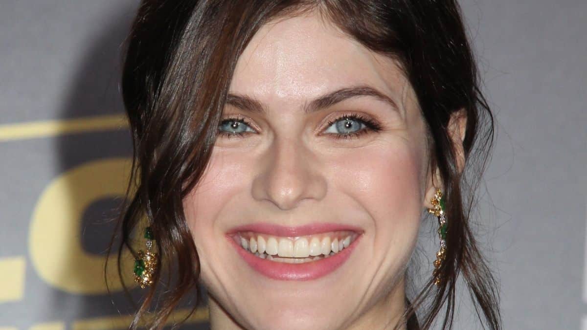 Alexandra Daddario nearly busts out of mint-green bikini together with her sister