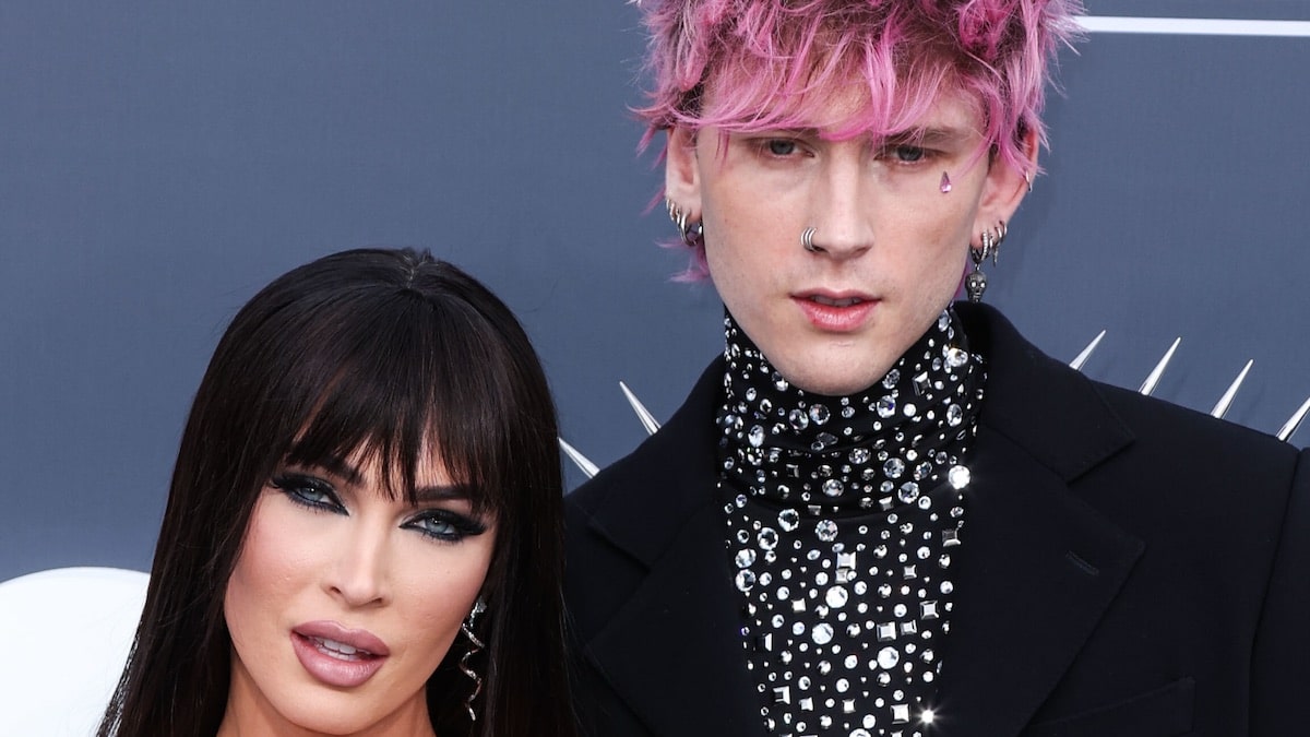 Megan Fox’s busty black gown with thigh excessive slit was an ideal match for MGK’s studded swimsuit