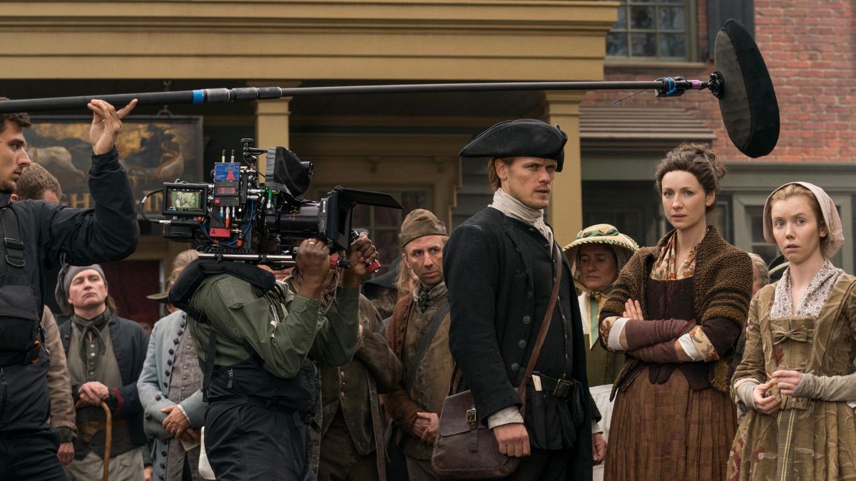 Sam Heughan as Jamie, Caitriona Balfe as Claire, and Lauren Lyle as Marsali, as seen behind the scenes of Episode 1 of Starz's Outlander Season 4
