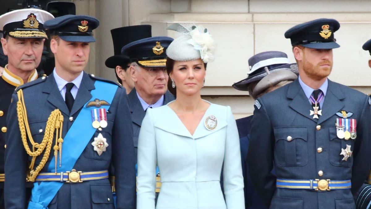 Kate Middleton stands between Prince William and Prince Harry in uniform