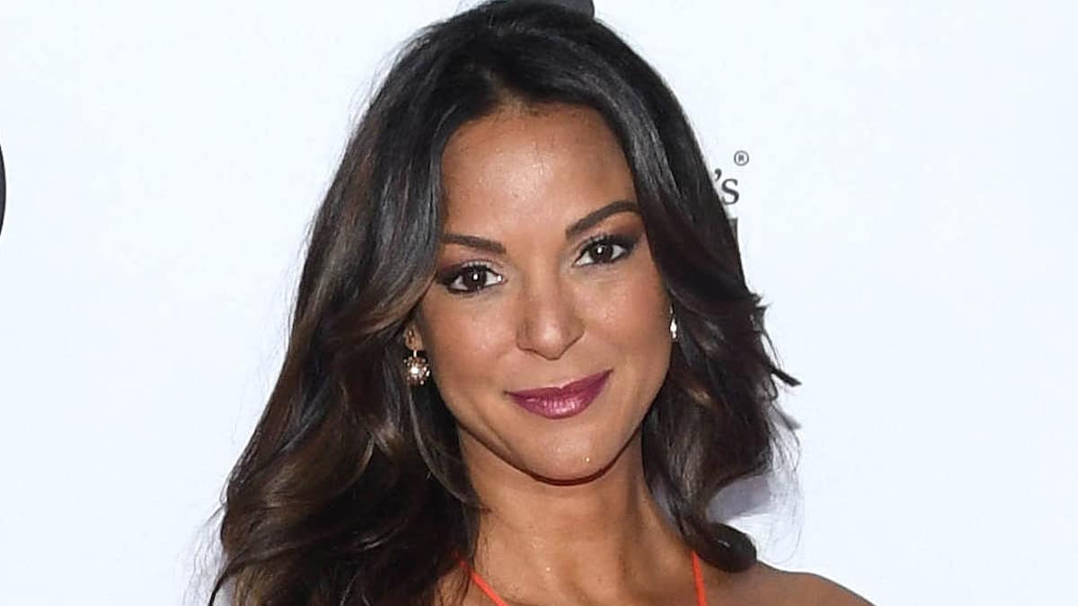 Eva LaRue showcases curves in fiery red bikini while beachside