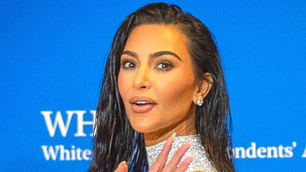 Kim Kardashian exhibits off then and now seashore photographs with all 4 youngsters