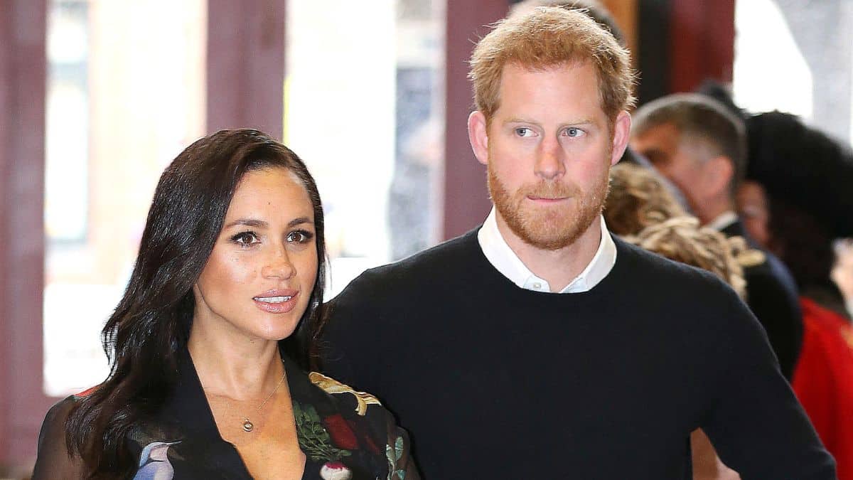 Meghan Markle and Prince Harry looking serious at an event
