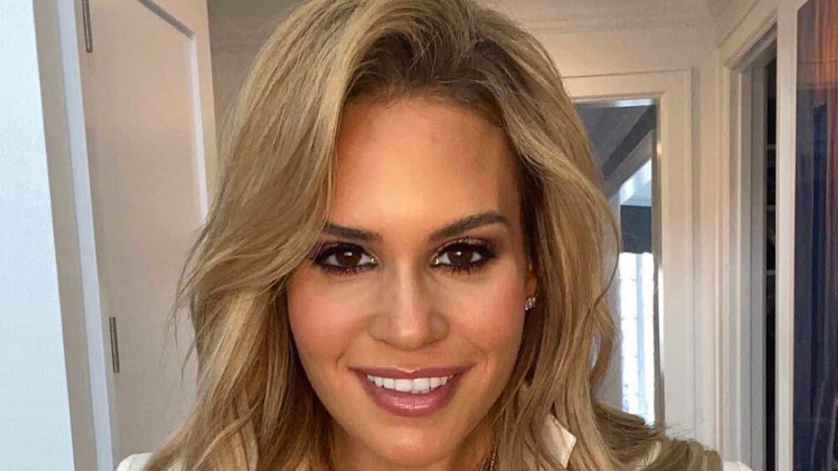 RHONJ star Jackie Goldschneider wears knitted crop top and designer sandals.