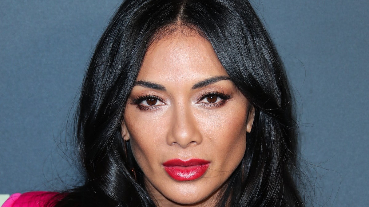 Nicole Scherzinger goes topless below swimsuit jacket for evening out