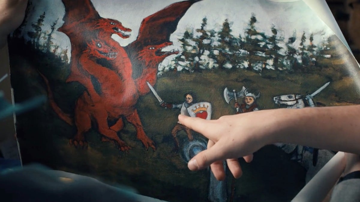 A picture of Will's painting closer up as he points out where Mike is and the heart on Mike's armor. 