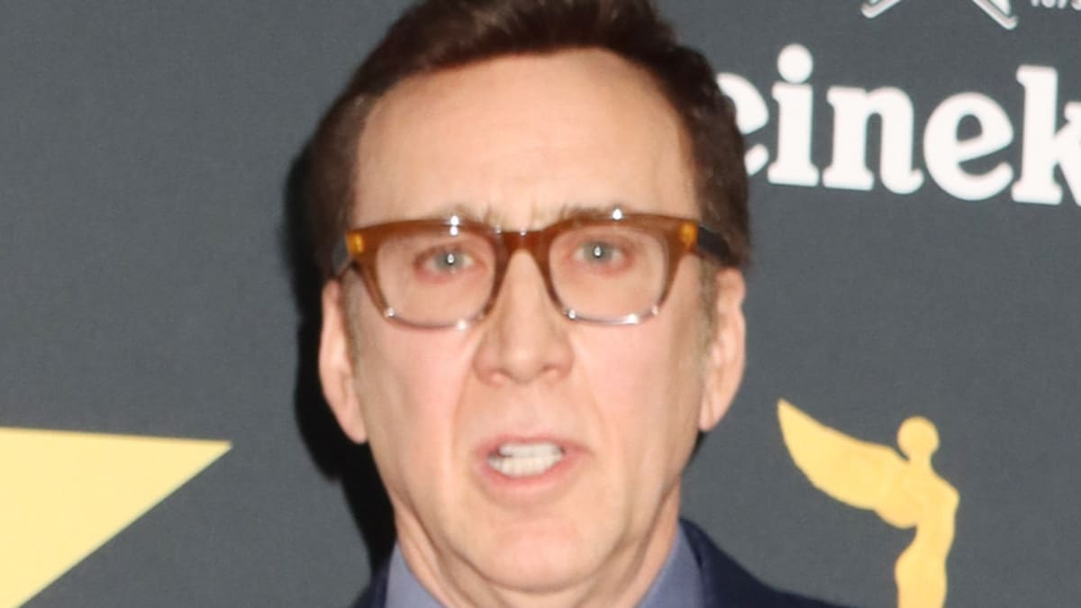 Nicolas Cage looks in Camera