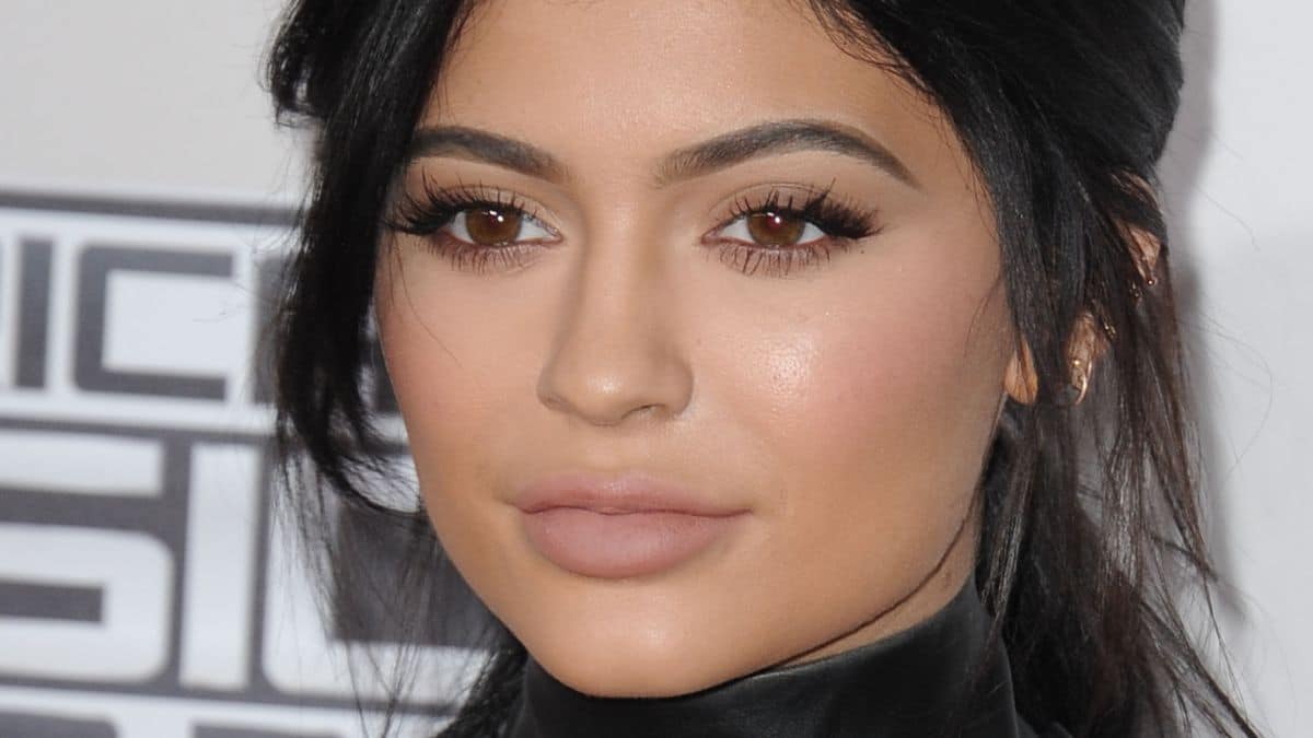 Kylie Jenner reveals some pores and skin in revealing black mini costume