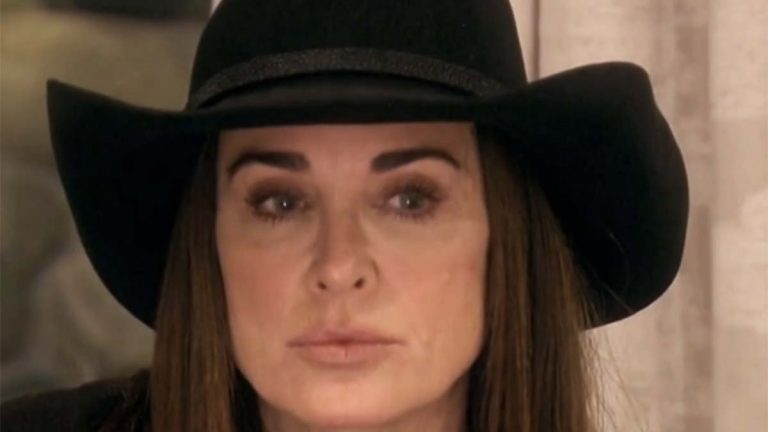 RHOBH's Kyle Richards wearing cowboy hat looking thoughtfully