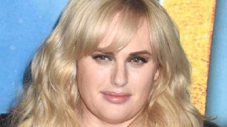 Rebel Wilson posing on red carpet of CATS premiere