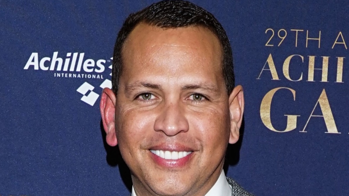 Alex Rodriguez smiles on the red carpet.