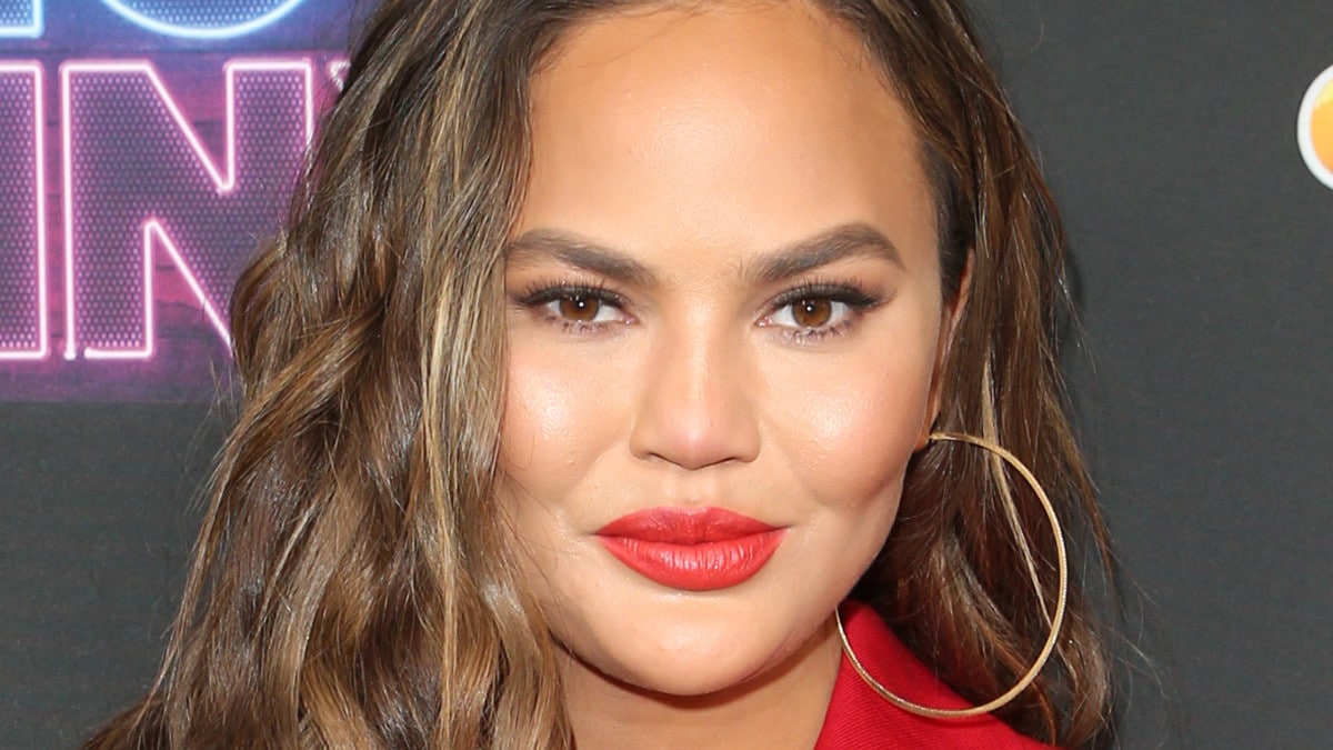 Chrissy Teigen poses at Bring the Funny premiere