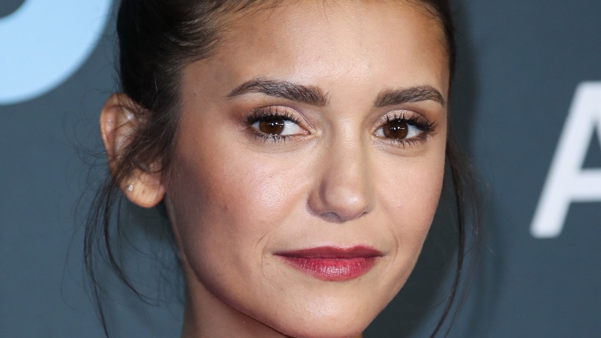 Nina Dobrev wraps up in nothing but a towel for sauna session