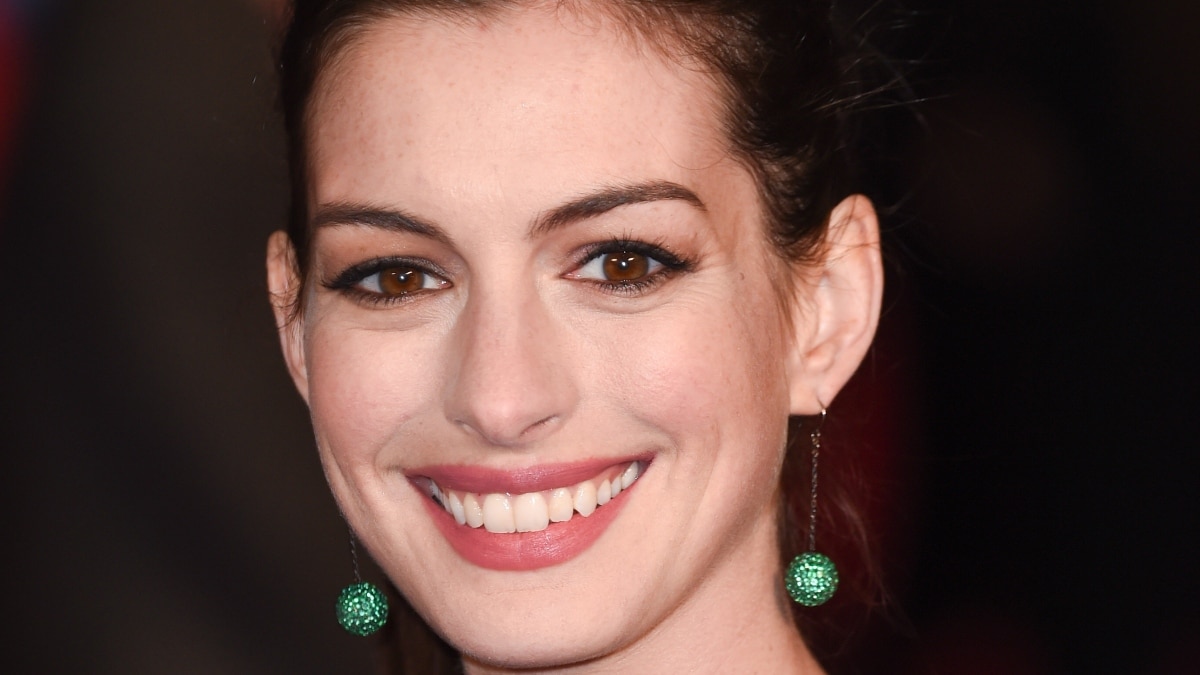 Anne Hathaway smiles for the camera