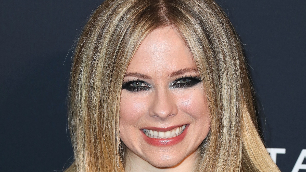 Avril Lavigne smiles into camera.