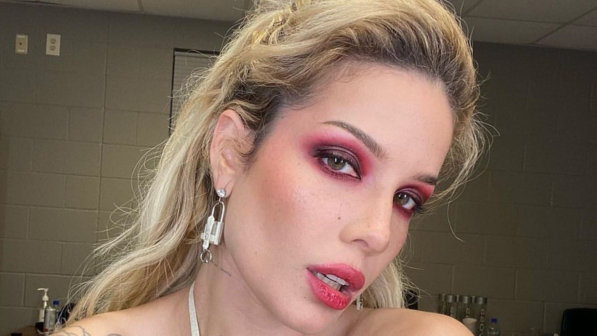 Halsey posing with red eyeliner