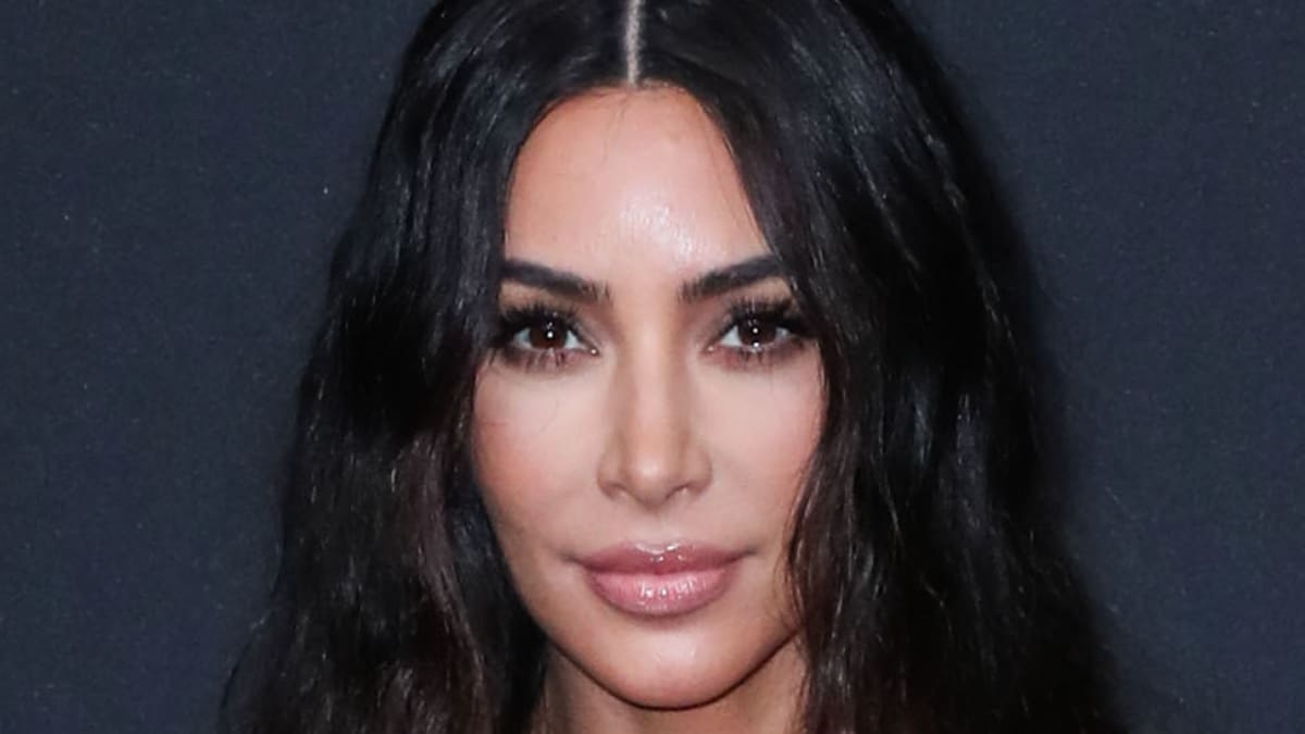Kim Kardashian gazes into the camera.