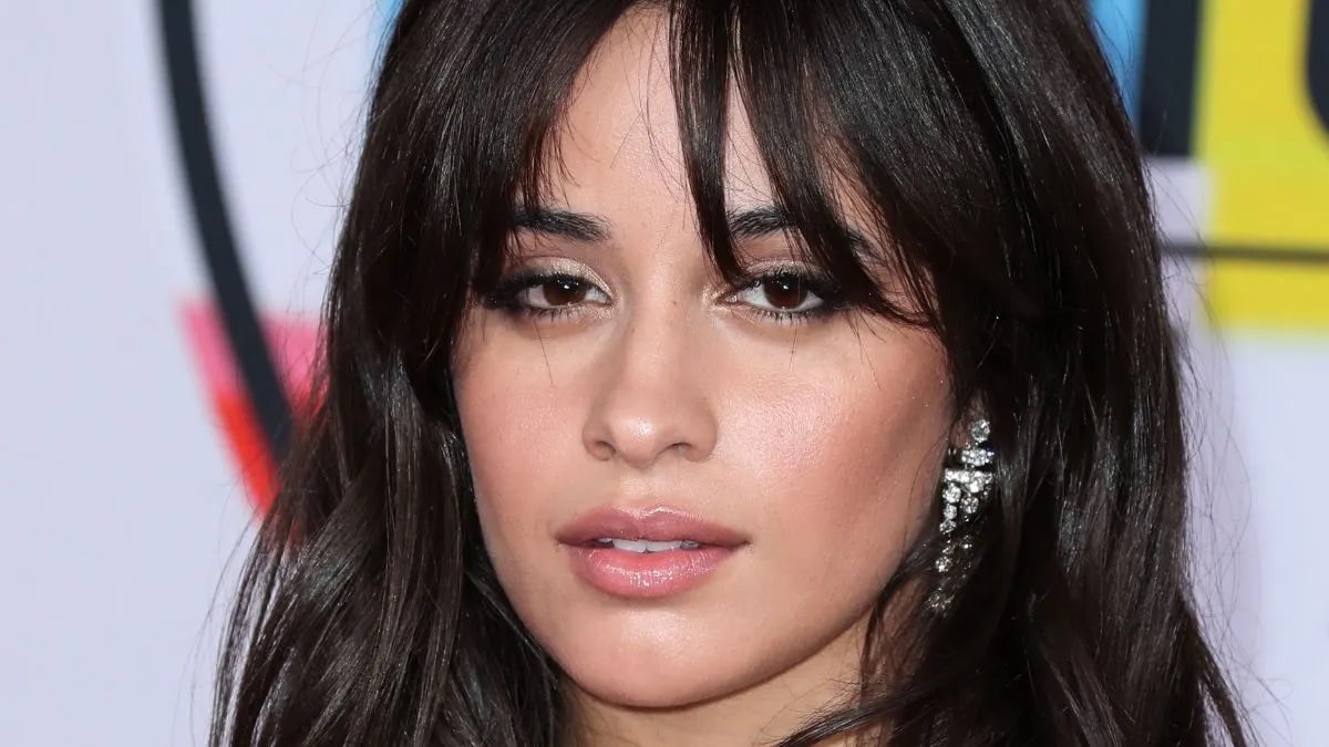 Camila Cabello shows off her long sparkling earrings.
